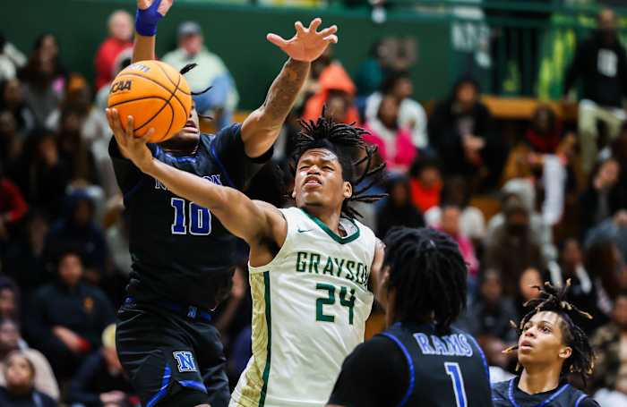 Grayson senior guard Gicarri Harris splits two defenders on his way to the basket. (Photo: Colin Hubbard)
